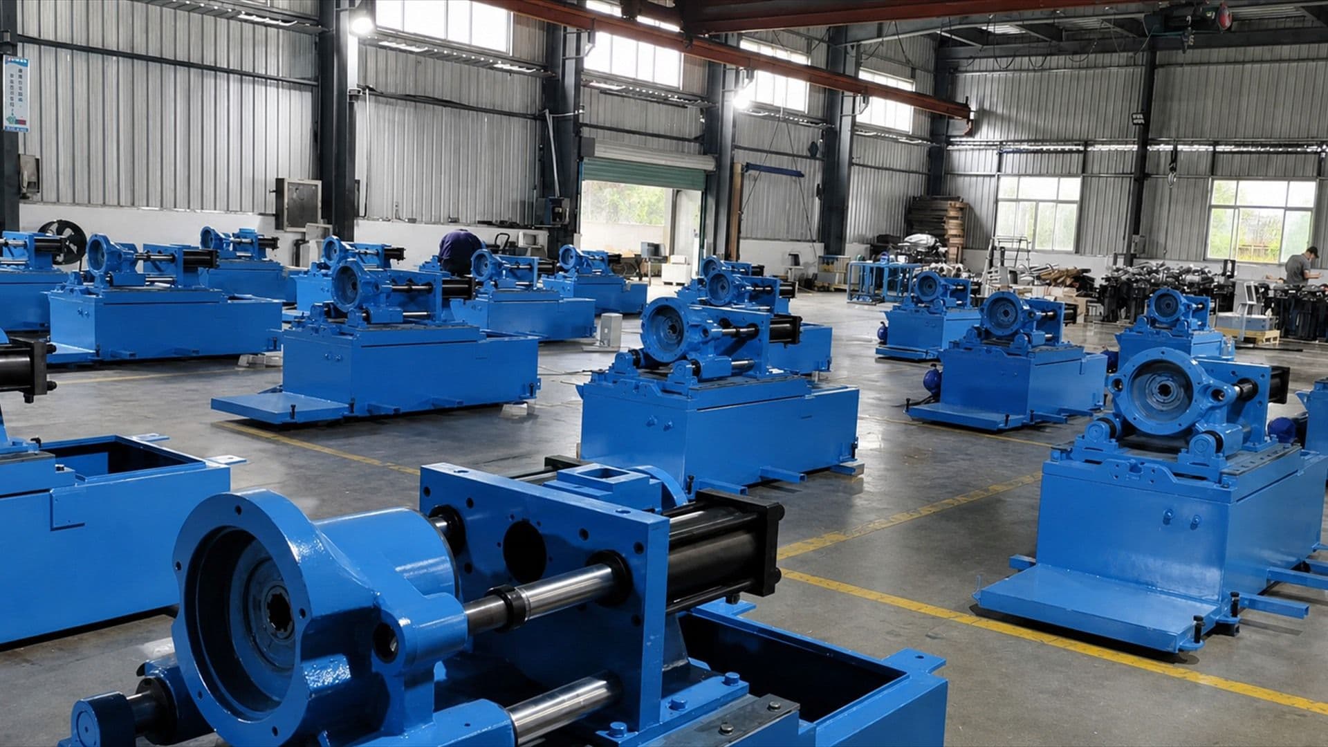 Blue shoe machinery arranged across the Xingzhong factory floor